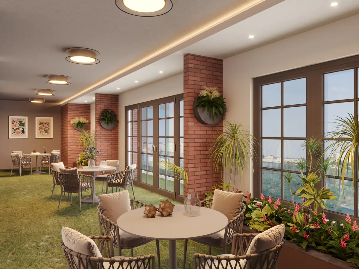 Community lounge with brick walls and garden seating at Sun Garnet