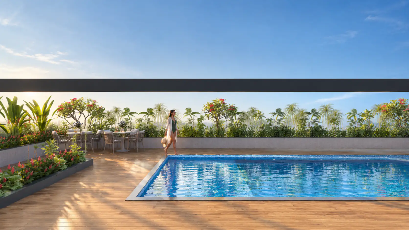 A woman walks beside the rooftop swimming pool and timber deck at Sun Garnet, under an open blue sky